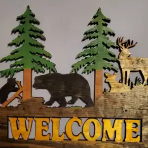 Wooden wildlife welcome sign featuring bears, deer, and pine trees for rustic home decor.