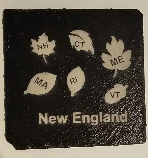 Laser engraved slate coaster featuring New England states with abbreviations.