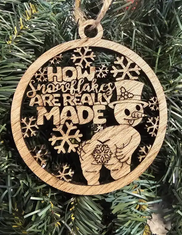 Wooden snowflake ornament with snowman and humorous "Ho Ho Ho" message for holiday decor.