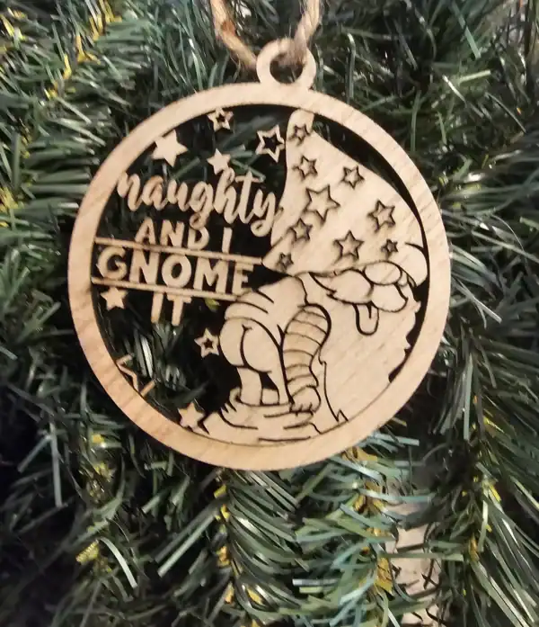 Naughty and Gnome It Christmas ornament with a gnome and stars, perfect for holiday decor.