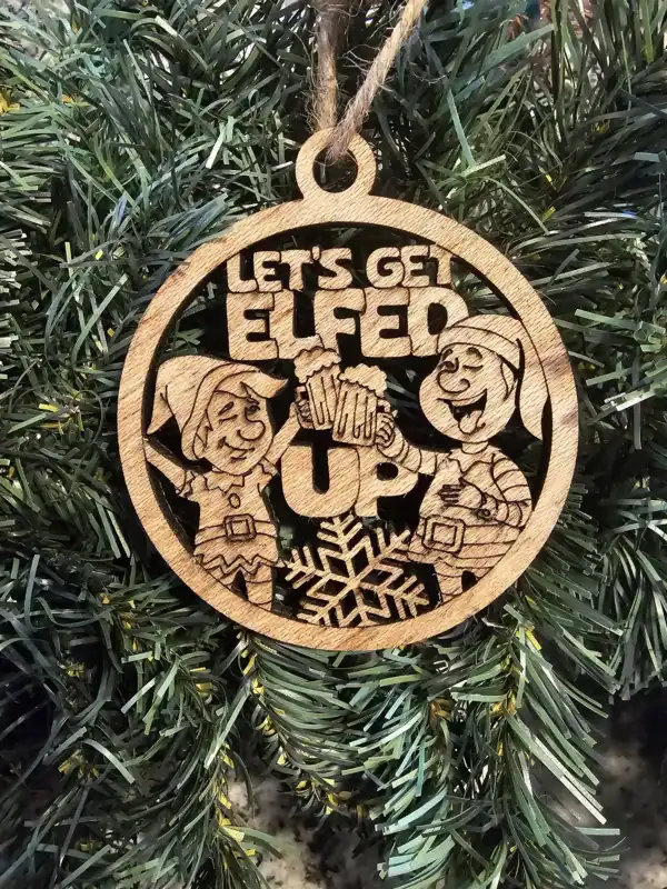Elfed Up Christmas ornament with elves and snowflake design.