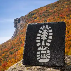 Engraved slate coaster featuring a detailed boot print design, perfect for outdoor enthusiasts and h.