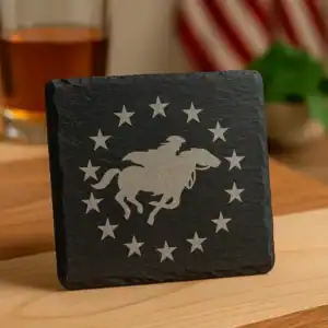 Slate coaster with engraved Paul Revere riding horse and stars design.