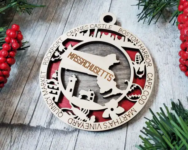 Massachusetts State Ornament with laser engraving of the state map and iconic landmarks.