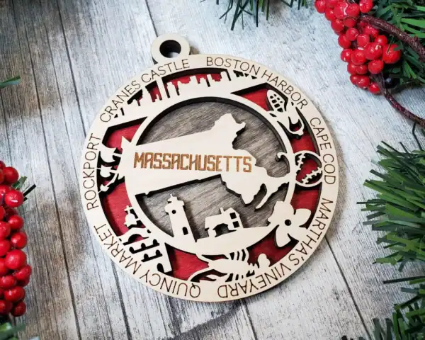 Massachusetts State Ornament with laser engraving of the state map and iconic landmarks.