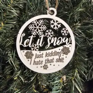 Ornament with snowflakes and humorous quote for holiday decor.