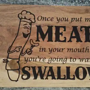 Humorous meat swallow design on wooden cutting board for kitchen decor and gifts.