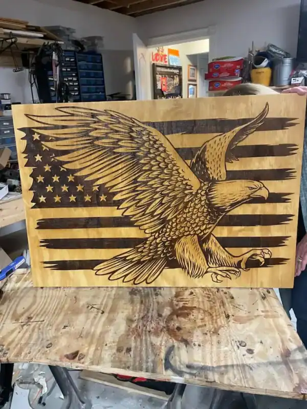 Engraved wooden American flag with eagle, 2'x3' patriotic wall art, handcrafted laser design.