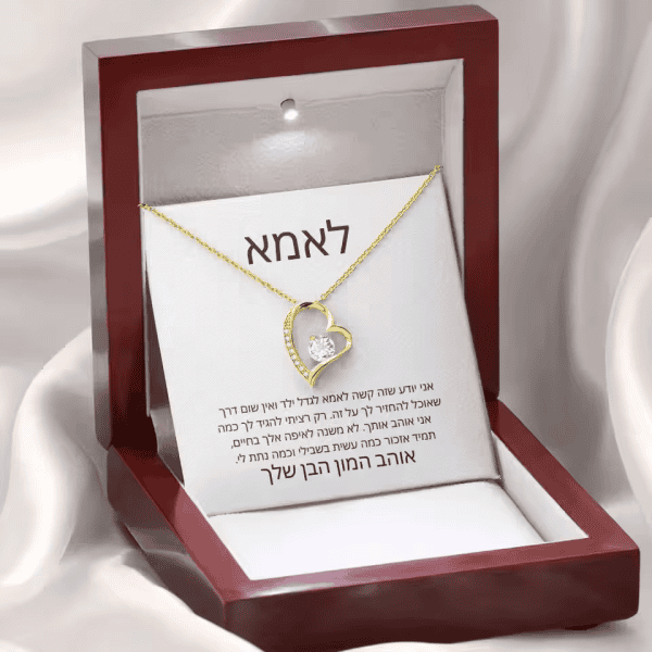 Elegant gold heart-shaped pendant with sparkling crystal, perfect custom jewelry gift.