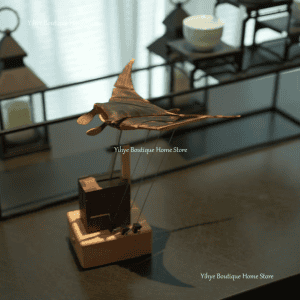 Stunning handcrafted metal origami bat sculpture for home décor or art collection. Unique, detailed, and artistic design.
