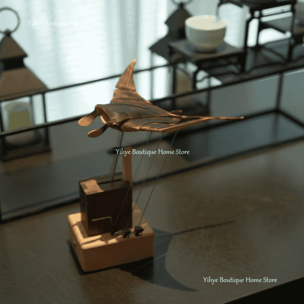 Stunning handcrafted metal origami bat sculpture for home décor or art collection. Unique, detailed, and artistic design.