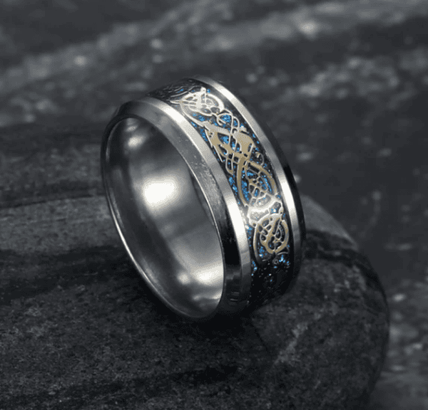 Detailed black and gold engraved men's wedding band, ideal for personalized jewelry and special occasions.